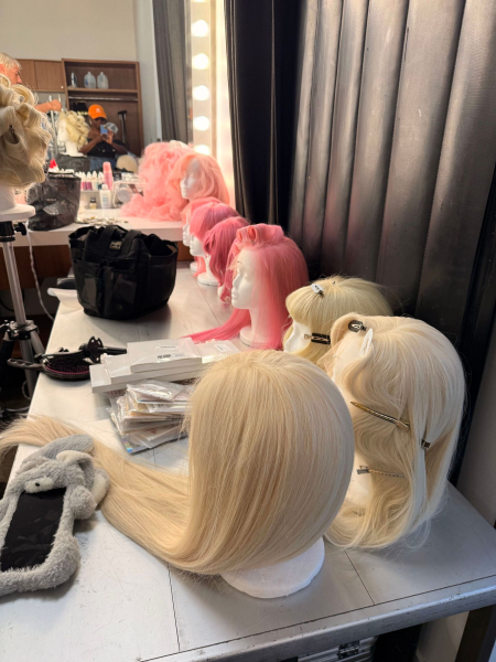 A handful of wigs backstage at a shoot.